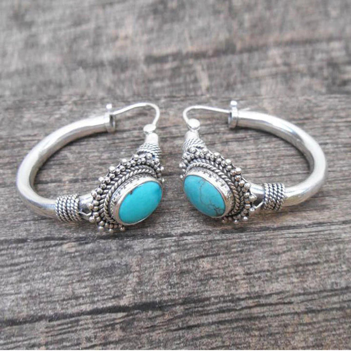 Elegante zilveren oorbellen met turquoise