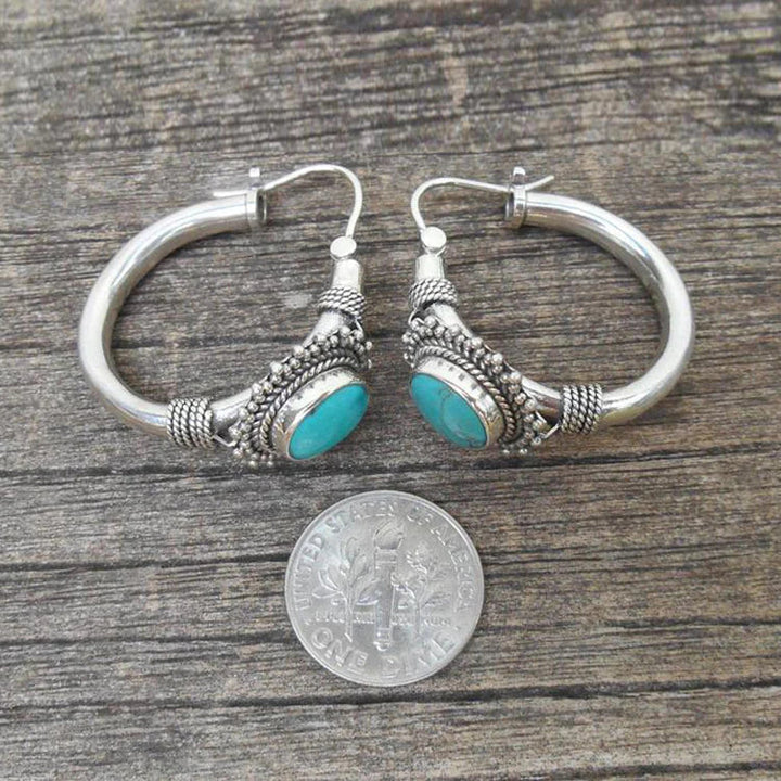 Elegante zilveren oorbellen met turquoise