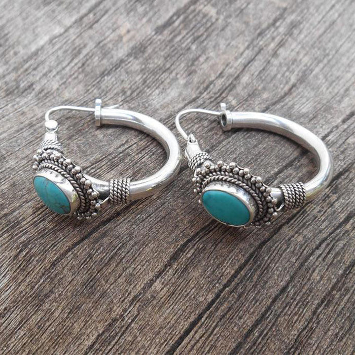 Elegante zilveren oorbellen met turquoise