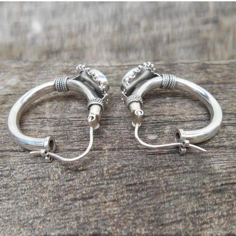 Elegante zilveren oorbellen met turquoise