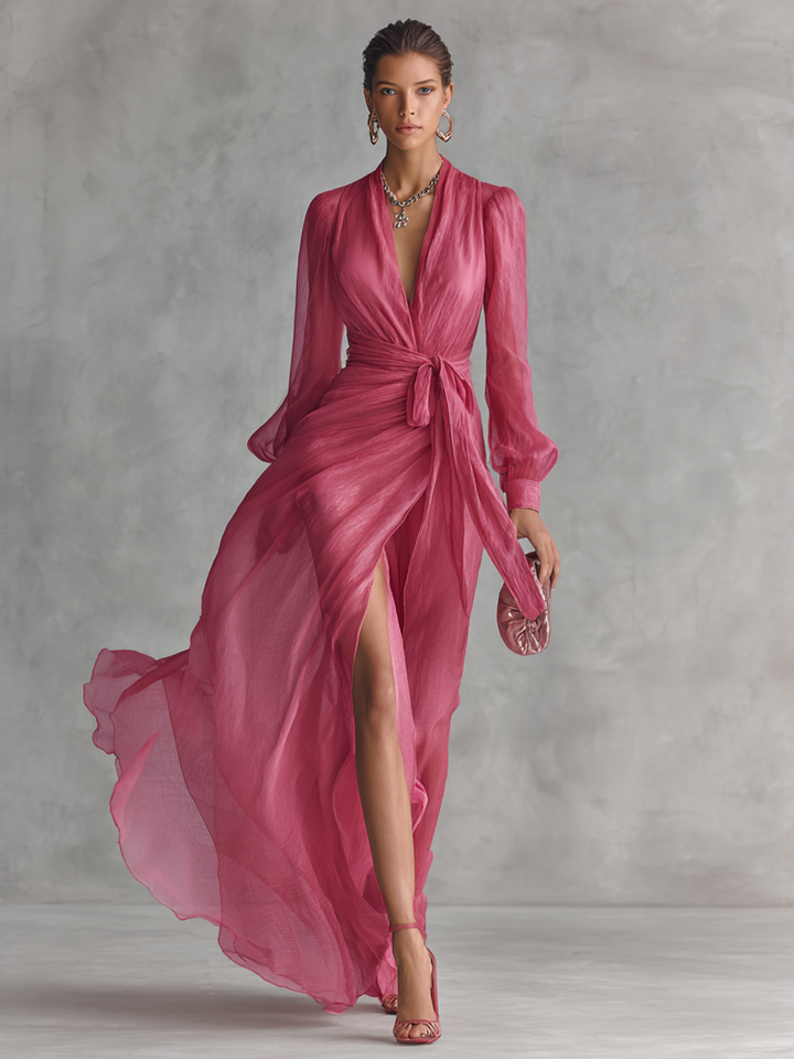 Elegante lange damesjurk in parelroze chiffon met V-hals en tailleband