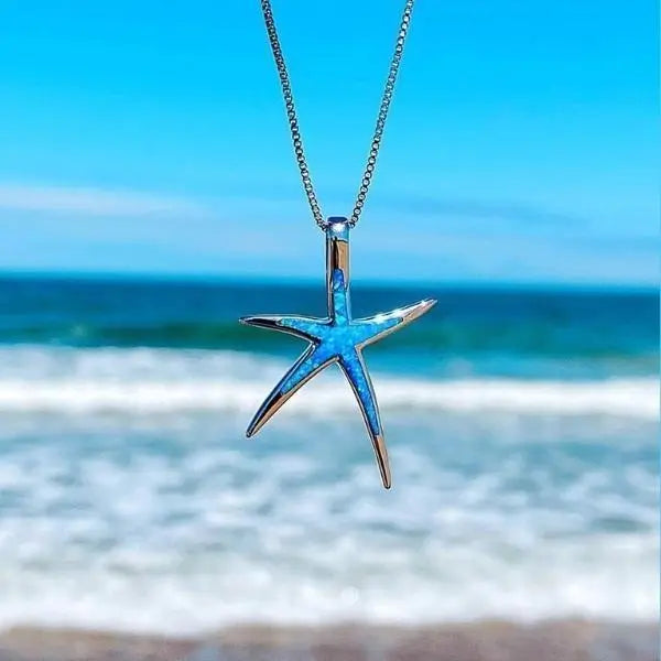 Zilveren collier met zeester hanger en blauwe opaal