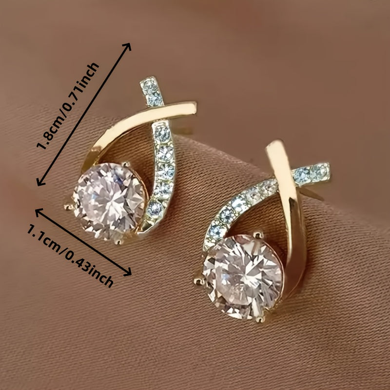 Oorbellen met gouden kruis en zirconium