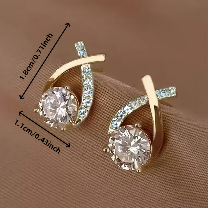 Oorbellen met gouden kruis en zirconium