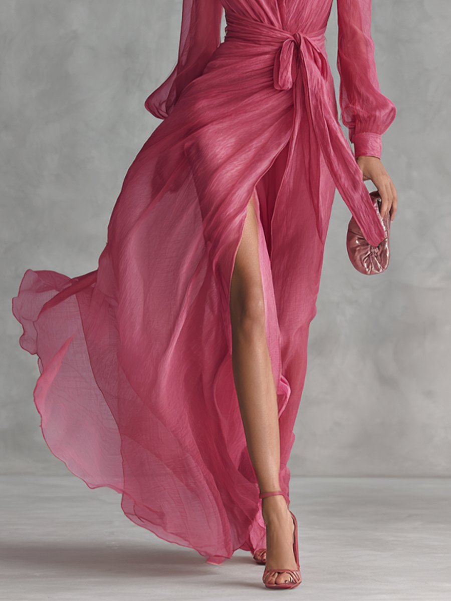 Elegante lange damesjurk in parelroze chiffon met V-hals en tailleband
