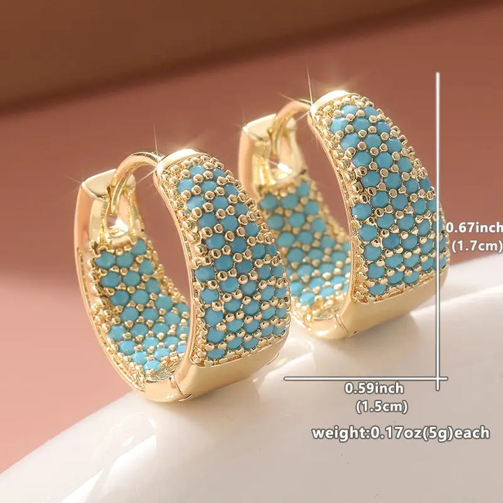 Elegante gouden creolen met turquoise parels