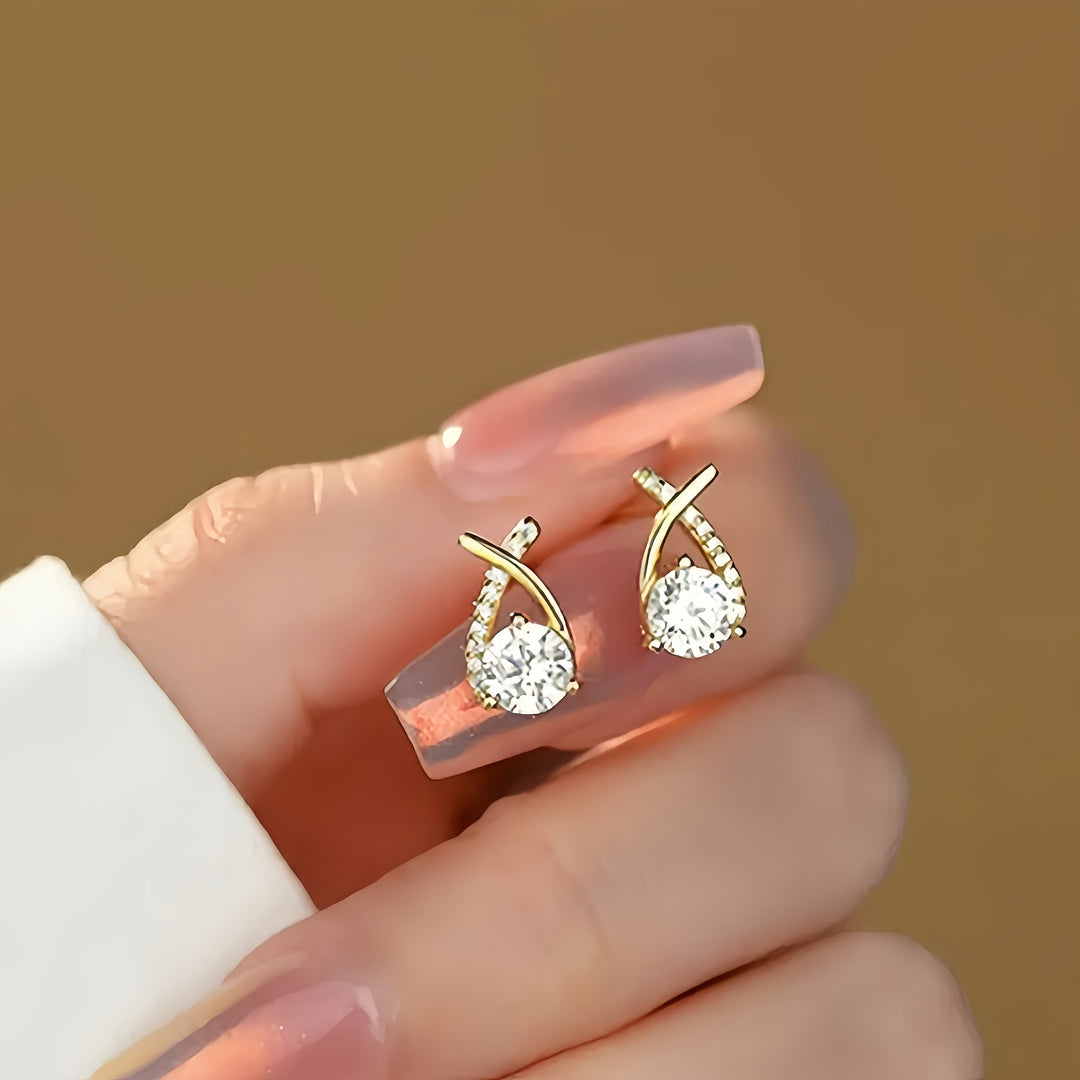 Oorbellen met gouden kruis en zirconium