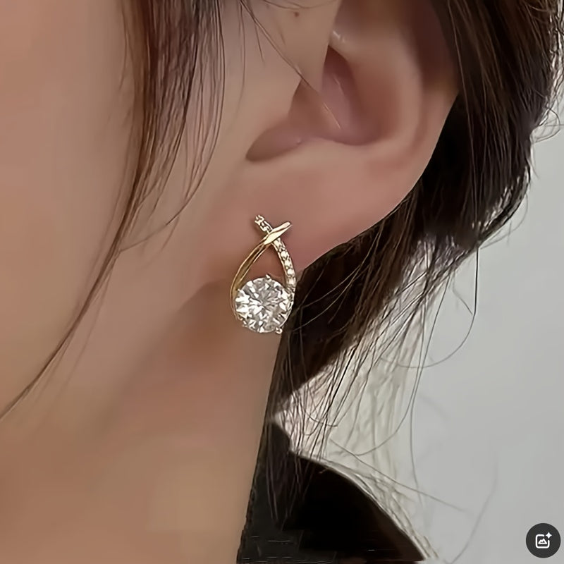 Oorbellen met gouden kruis en zirconium