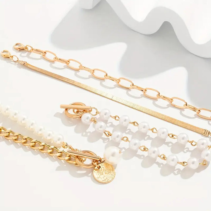 Elegante 4-delige gouden armbandenset – Slang, parels en schakels