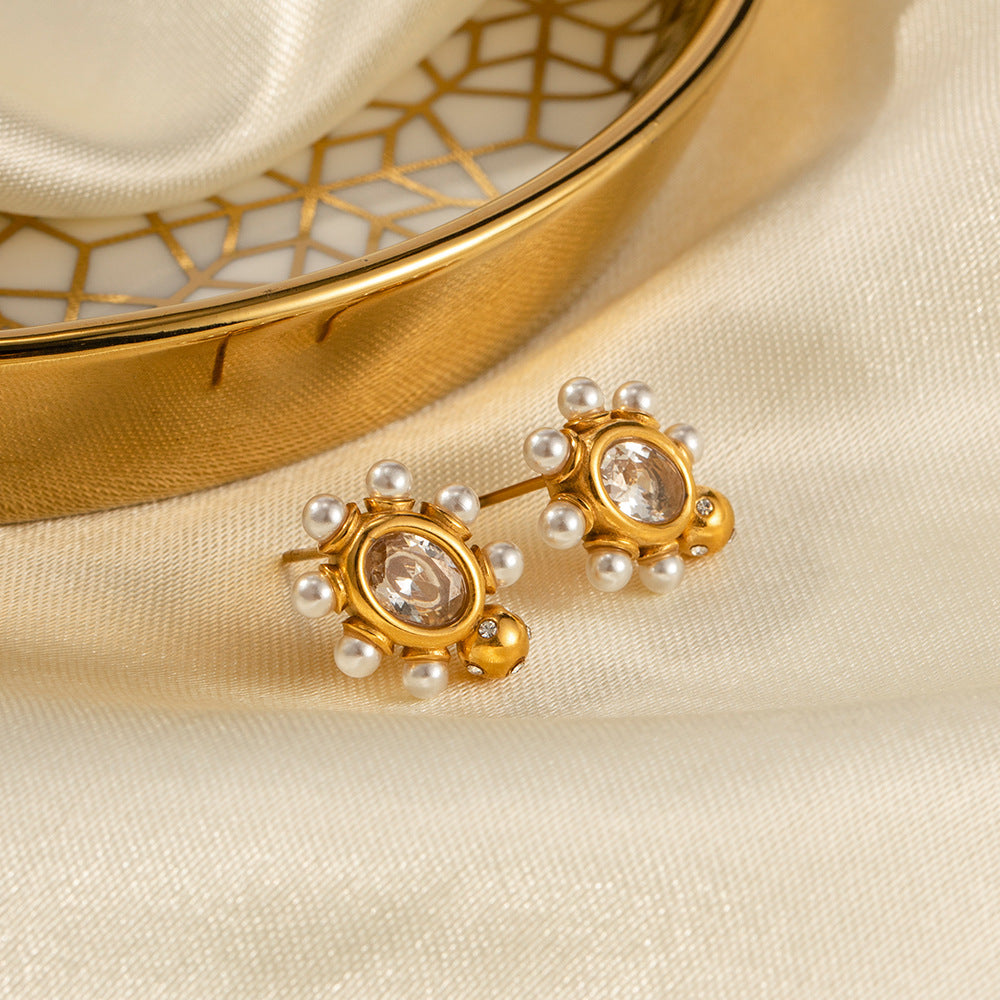 Elegante gouden oorbellen met parel