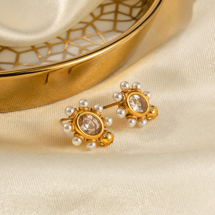 Elegante gouden oorbellen met parel