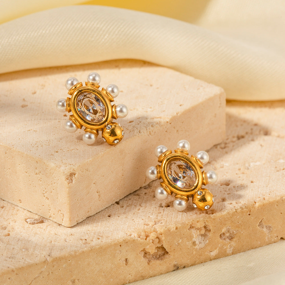 Elegante gouden oorbellen met parel