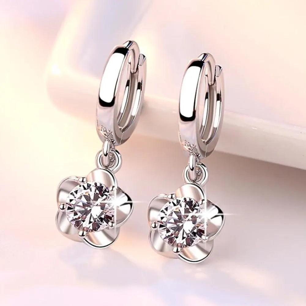 Sterling zilveren oorbellen met paarse en witte zirconia