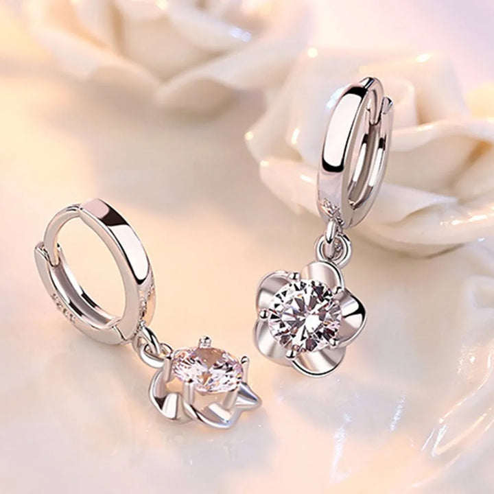 Sterling zilveren oorbellen met paarse en witte zirconia