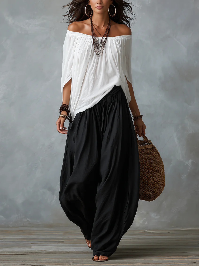 Mara • Set van witte blouse met blote schouders en zwarte palazzo broek