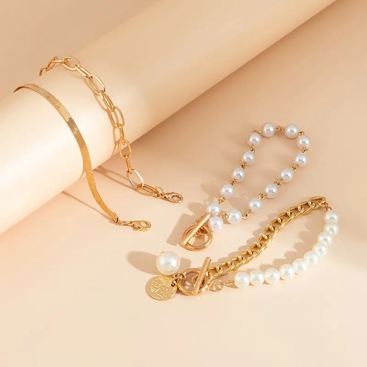 Chique gouden armbandenset (4 stuks) – slang, kralen en schakels