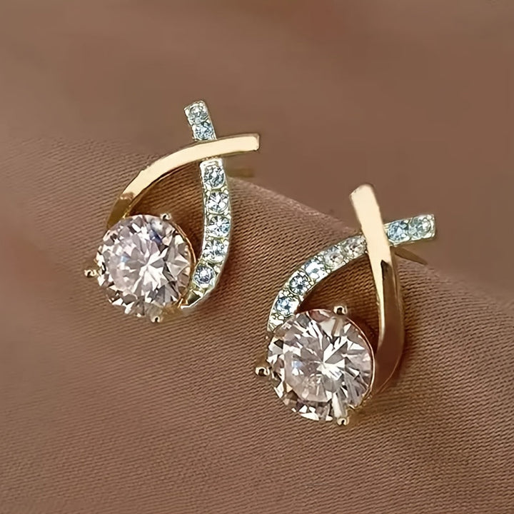 Oorbellen met gouden kruis en zirconium