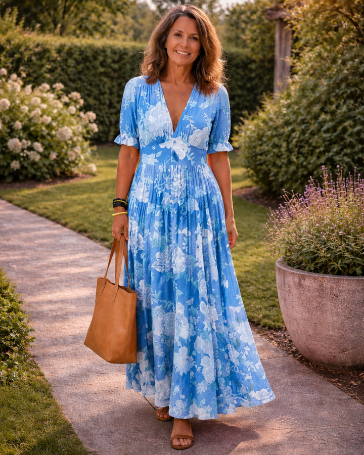 Ione | Korte mouwloze V-hals bloemen midi-jurk